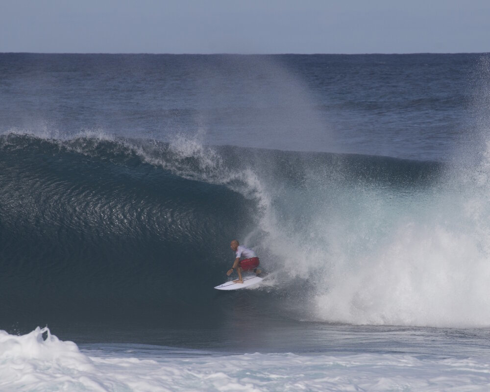 Kelly Slater, a true living legend of world surfing, emerges from a perfect barrel at Banzai Pipeline, Ehukai Beach Park, North Shore, O'ahu, Hawaii