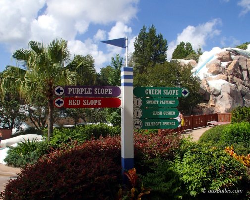 Signage for the different slides with color codes indicating thrill levels