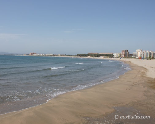The wide fine sandy beach of L'Estartit on the Costa Brava, facing the Medes islands