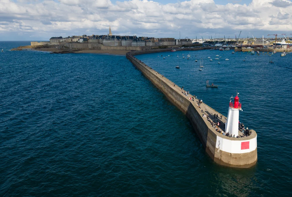Aerial view of Saint-Malo, with its lighthouse and pier in the foreground