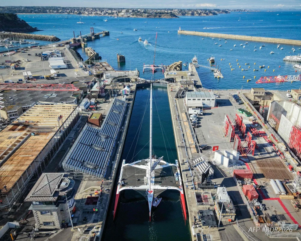 The Ultim trimarans pass through the locks of the Vauban basin in Saint-Malo ahead of the start